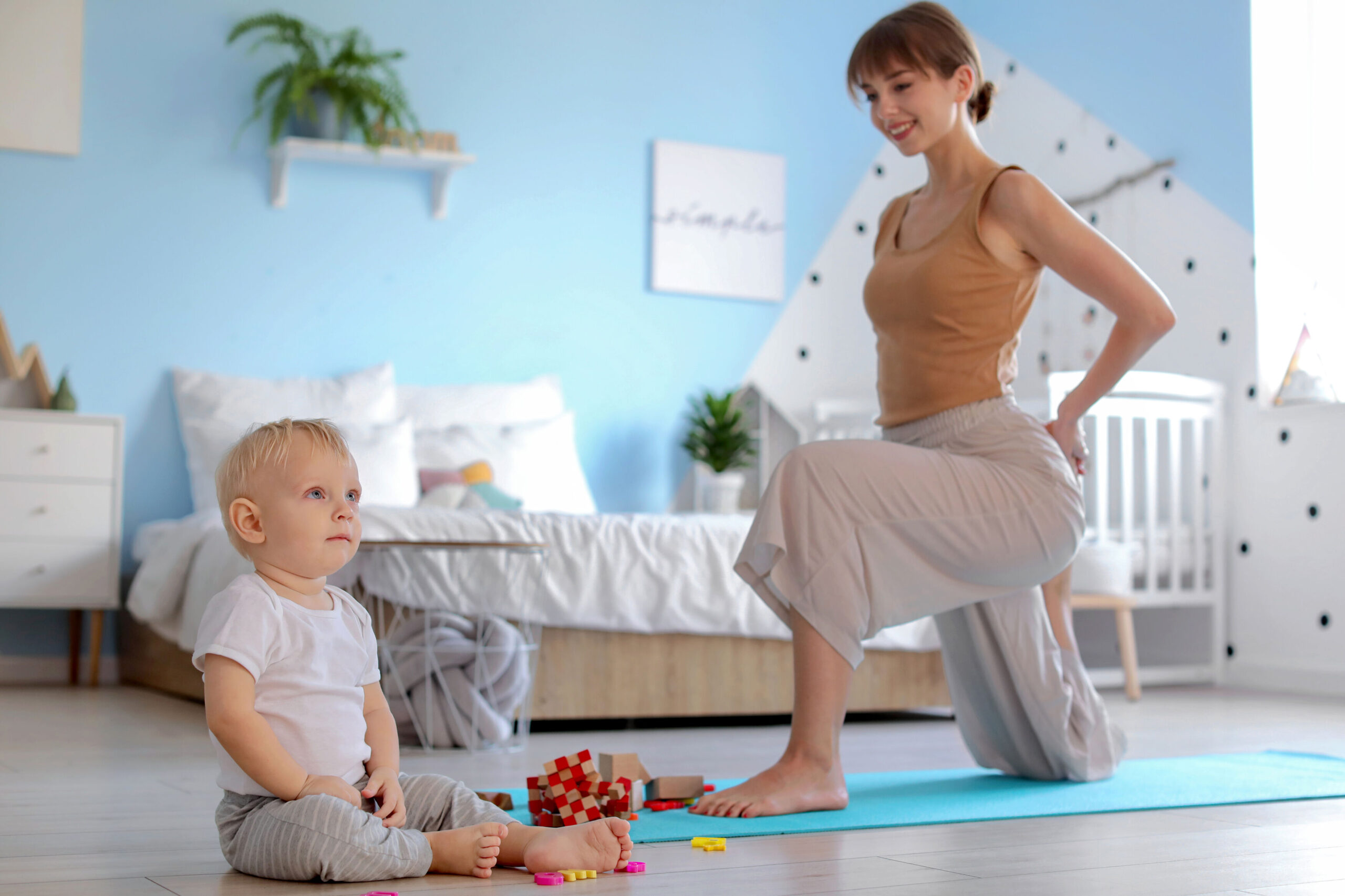 Mother engaging with toddler while managing breastfeeding and milk storage routine